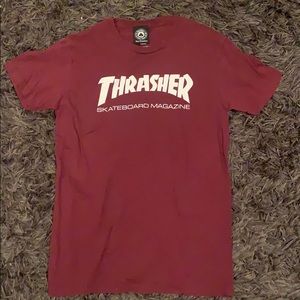 a burgundy short sleeve thrasher shirt